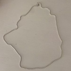 Pandoras long sterling silver chain. Please note charm not included